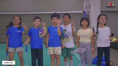 Children with badminton rackets at a school sports event