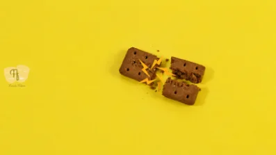 Chocolate pieces on a yellow background, from a stop-motion product film
